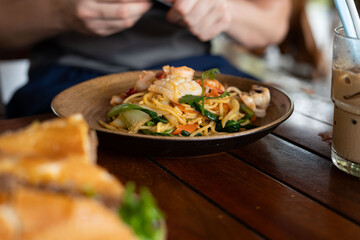 A delicious plate of food is sitting on a rustic wooden table