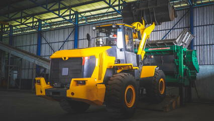 Malang of Indonesia, January 18th 2025, Yellow Tractor Inside Industrial Building