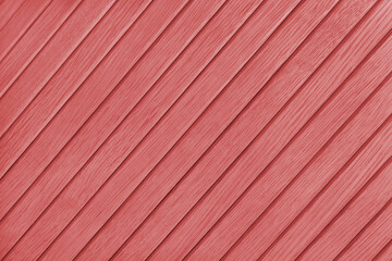 Wooden diagonal plank, bamboo surface texture, board wall background. Painted wooden panels red color, wallpaper, backdrop, design element.