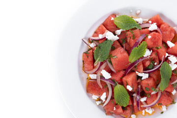 Fresh Watermelon Feta Salad with Mint and Red Onion isolated on white background. Top view. Copy space