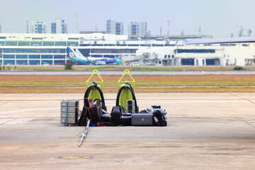 Equipment for supporting the operations of fighter aircraft piled up near the aircraft parking area.