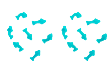 Jelly fish candies. Gummy shark, blue dolphin jelly coated with sugar on a transparent background.