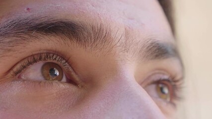 A young man's eyes widen in realization, captured in a side view. This moment of awareness reflects a significant breakthrough in his understanding.