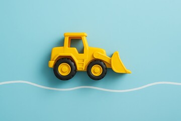 Adorable Yellow Toy Bulldozer on a Light Blue Background Perfect for Children's Room Decor, Playtime Fun, and Construction Themed Projects