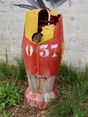 old and damaged red fire hydrant