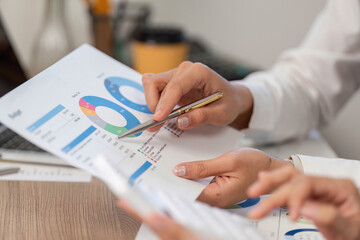 Business Collaboration and Financial Analysis. Professionals discussing budget reports in a modern...