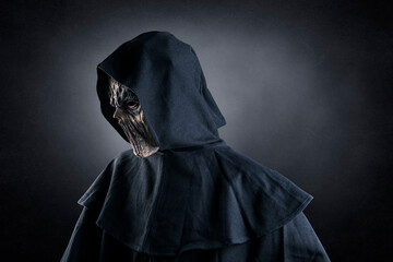 Portrait of a creepy monster over dark misty background