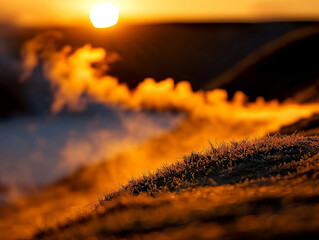 Stunning sunrise illuminates misty landscape, where steam rises from ground, creating magical atmosphere. warm colors of dawn blend beautifully