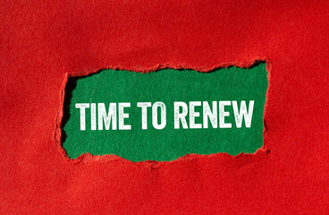 Time to renew message written on ripped torn red paper on green background. Conceptual time to renew symbol. Copy space.