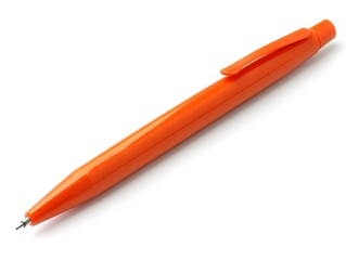 A single orange ballpoint pen lying diagonally on a white surface in a studio setting, close up view