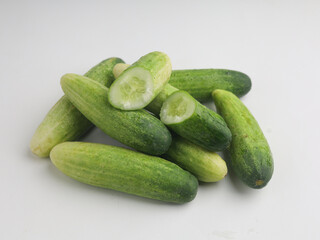 Piled of cucumbers on white background