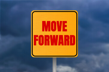 Move forward message written on metal sign on cloudy sky background. Conceptual move forward symbol. Copy space.