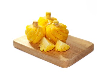 Ready for eat with pineapple fruits on white background and wooden plates.