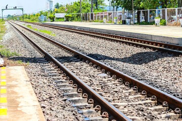 Fototapeta premium Railroad tracks in concept translation train station.