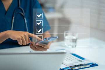 Fototapeta premium Doctor using smartphone to do online checklist survey, doing assessment online survey answer test questions Digital form.