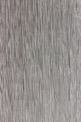 Naklejka premium texture of valuable wood. wooden gray board. lumber. koto, African, Pterygota, view from above. vertical texture