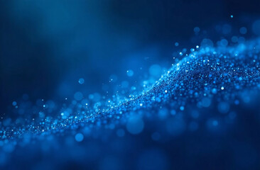 abstract image featuring a mesmerizing array of sparkling blue particles set against a smooth, dark background. light and texture