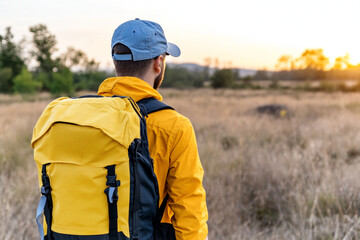 Backpack at sunset through serene wilderness landscapes