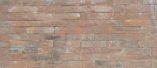Obraz premium Textured Red Brick Wall with Natural Variations
