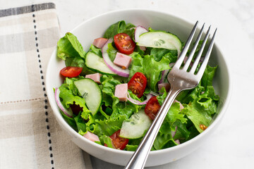 salad top with ham