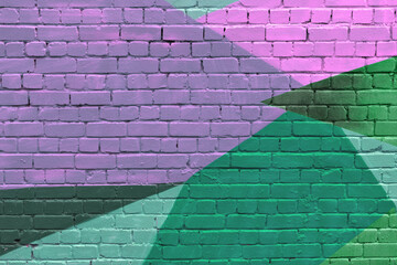 Abstract geometric mural with overlapping shapes in pink, green, and purple covers brick wall, creating bold urban background for creative projects. © SOLDATOOFF
