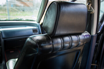 Shiny Black Leather Armchairs Inside Vintage Car – Classic Automotive Interior Design