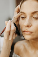 Fototapeta premium Face Makeup. Makeup Artist Work in Beauty Salon