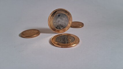 Brazilian Real coins on white background 