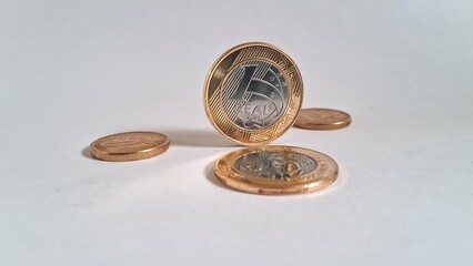 Brazilian Real coins on white background 