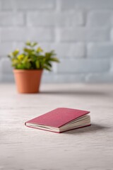 Open passport on a desk beside investment book, Financial independence