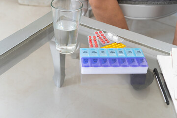 Doctor visiting patient at home and giving prescription drugs