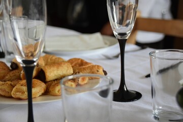 pastries and wine glasses on a table