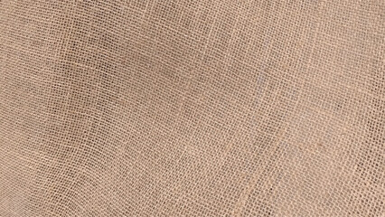 Jute pattern, rough burlap texture. Brown burlap cloth background or sack cloth for packing.