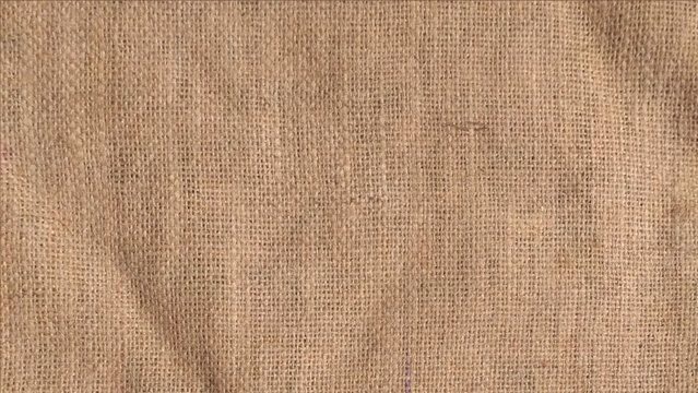 Jute pattern, rough burlap texture. Brown burlap cloth background or sack cloth for packing. Natural linen threads texture. Sackcloth, empty space.