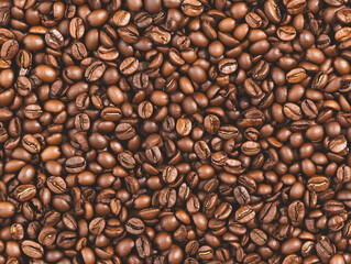 Fototapeta premium Roasted coffee beans forming a textured background