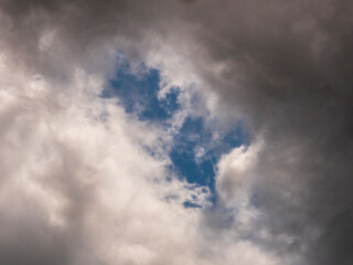 Opening in the Storm: A Glimpse of Blue Sky