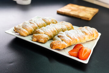 Puff pastry with chocolate and strawberries. Baking. Dessert. Dough.