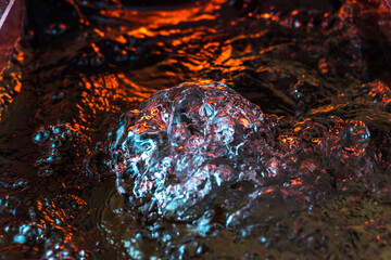 imitation of the sea in the lava of a volcano, the texture of the water rumbles chaos with bubbles...