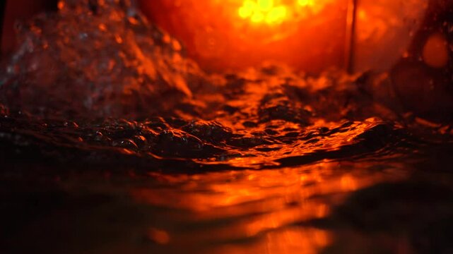 imitation of the sea in the lava of a volcano, the texture of the water rumbles chaos with bubbles created by the air that comes out in the red light