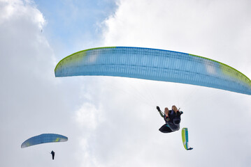 Paragliding pilot taking off in a competition