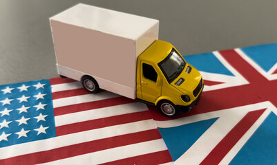 Miniature toy. There is american flag, toy of truck.