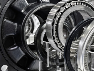 Detailed view of precision metal bearings and components displayed in a modern industrial setting