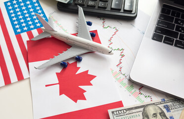 flags of the USA and Canada, dollars, charts