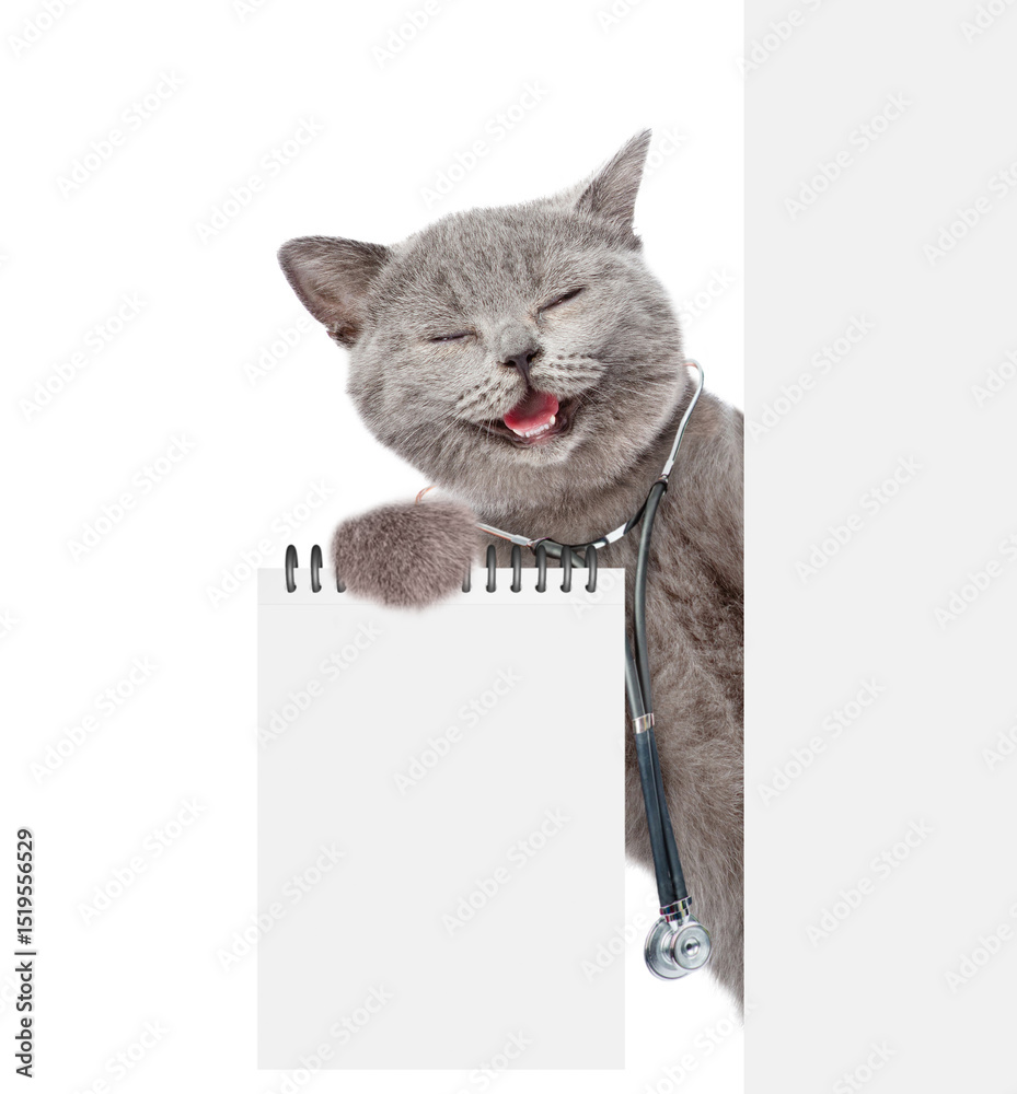 Aufkleber Smiling cat dressed like a doctor with stethoscope on his neck looks from behind blank white banner and shows blank list. Empty space for text. isolated on white background