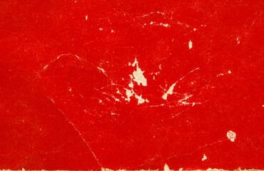 A sheet of worn red glossy paper texture as background