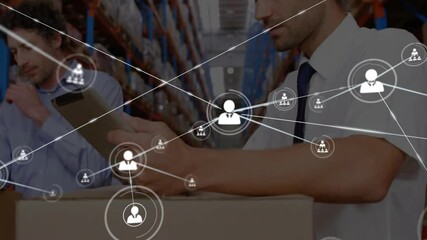 Warehouse coworker tapping digital tablet and initiating network overlay showing supply chain - Powered by Adobe