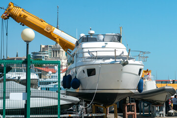 White boat in the parking lot of the resort town port.