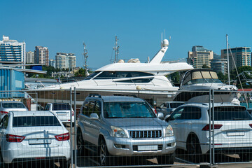 White boat in the parking lot of the resort town port.
