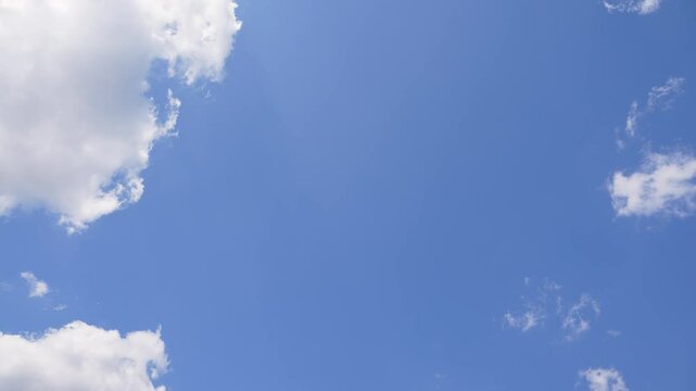 Sky with Clouds. Timelapse Cloudy Sky. Time-lapse shot of a sunny sky with a few, fast-moving clouds.