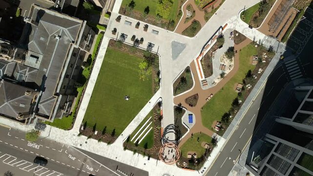 Wide, rising aerial video of City Quays Gardens in Belfast, Northern Ireland, UK on a bright and sunny day. Produced in 4K, 60FPS and with Rec709 color.